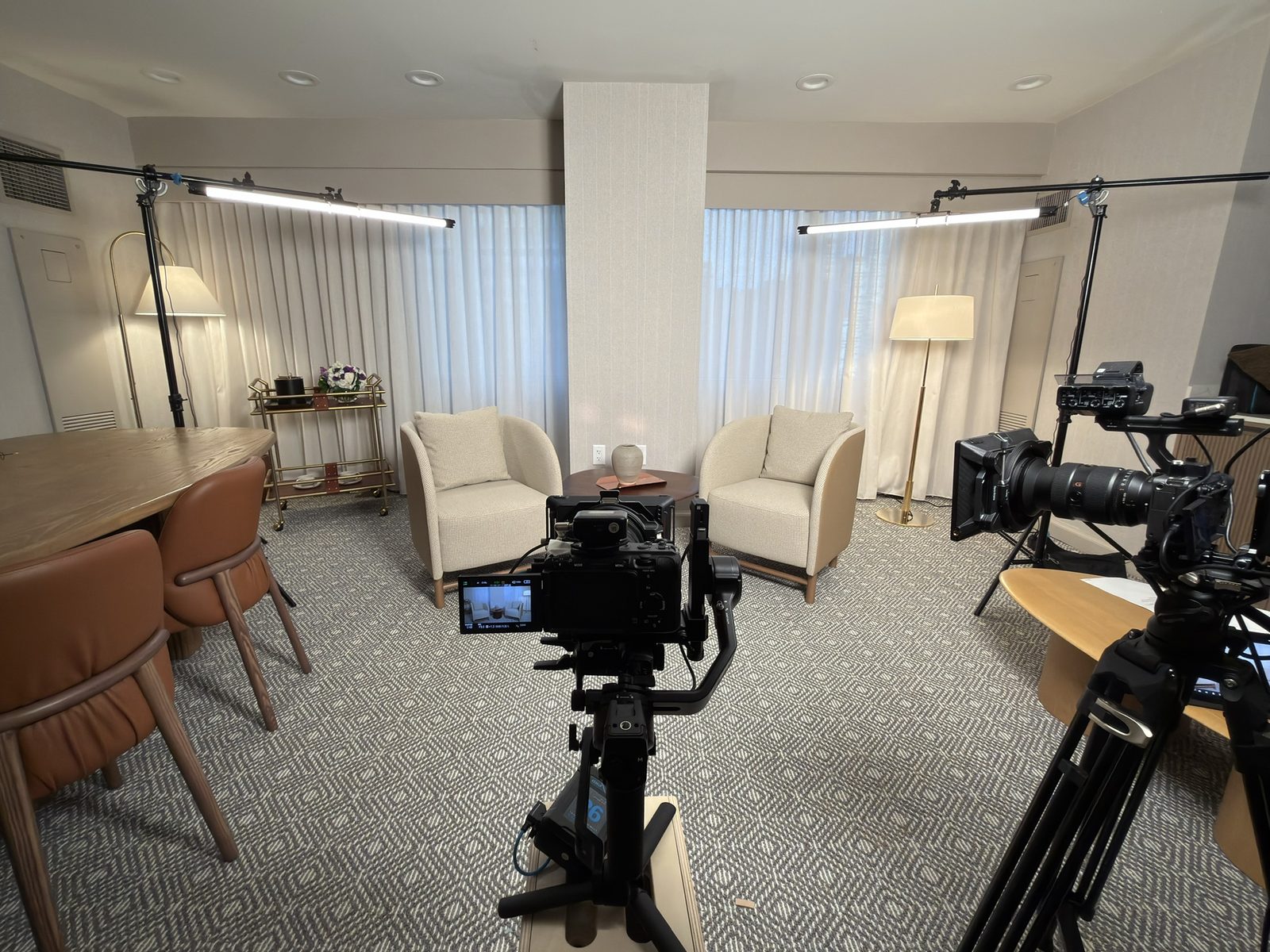Lighting and camera setup built into a hotel suite for an on-location interview shoot
